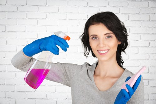 Technician handling carpet cleaning chemicals carefully